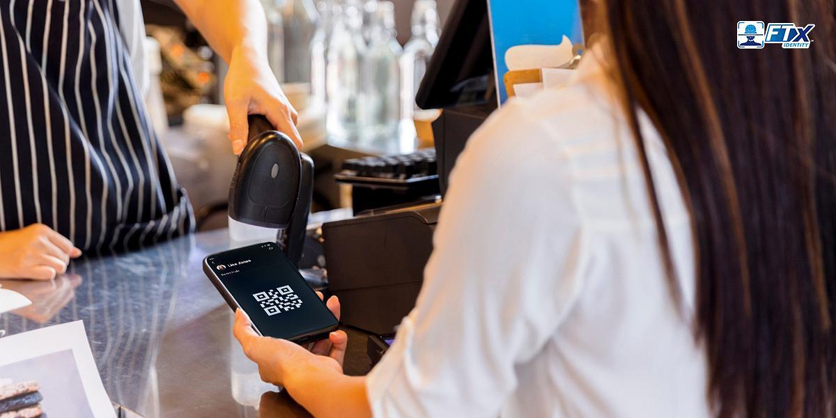 Retail worker scanning QR code to prove customers age - How to Use Age Verification in Business